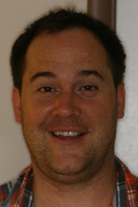 Full-face photo of patient after receiving porcelain crowns from Pasadena dentist Dr. Arash Azarbal.