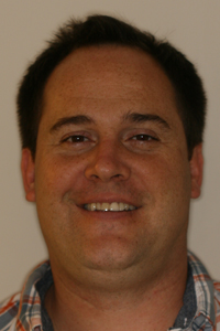 Full-face photo of patient before receiving porcelain crowns from Pasadena dentist Dr. Arash Azarbal.