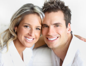 man and woman smiling